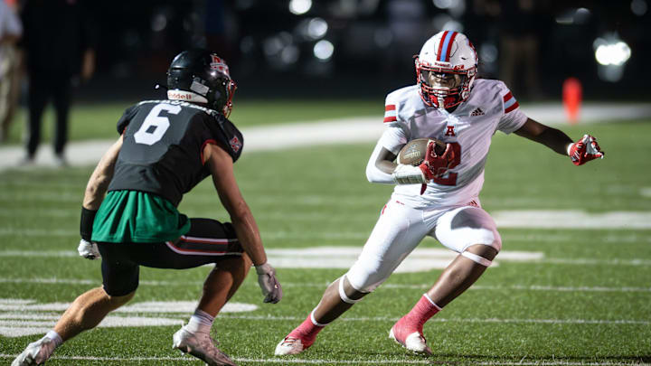 Arrowhead running back Devin Nettles (2) tries to elude Muskego linebacker Xavier Witkowski (6) in a Classic 8 Conference game Friday, September 19, 2025. Arrowhead running back Devin Nettles (2) tries to elude Muskego linebacker Xavier Witkowski (6) in a Classic 8 Conference game Friday, September 19, 2025.