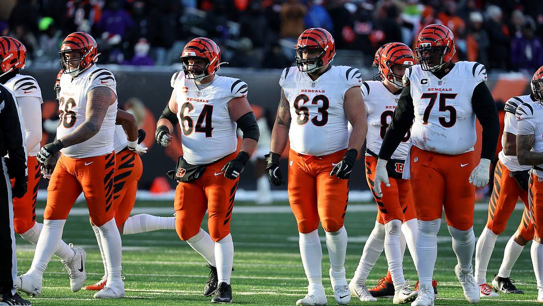 Dec 14, 2025; Cincinnati, Ohio, USA;  Cincinnati Bengals center Ted Karras (64) and guard Dylan Fairchild (63) and  offensive tackle Orlando Brown (75) line up for a play during the fourth quarter against the Baltimore Ravens at Paycor Stadium. Mandatory Credit: Joseph Maiorana-Imagn Images