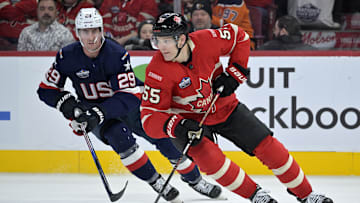 Feb 15, 2025; Montreal, Quebec, CAN; [Imagn Images direct customers only] Team Canada defenseman Colton Parayko (55) plays the puck and Team United States forward Brock Nelson (29) defends in the third period during a 4 Nations Face-Off ice hockey game at the Bell Centre. Mandatory Credit: Eric Bolte-Imagn Images