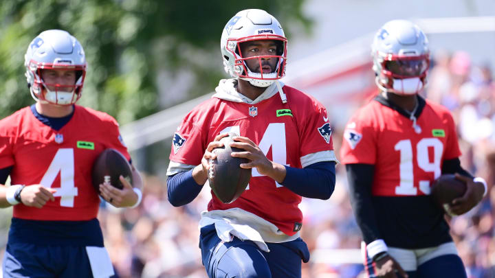 Jul 26, 2024; Foxborough, MA, USA; New England Patriots quarterback Jacoby Brissett (14) throws a pass during training camp at Gillette Stadium. Mandatory Credit: Eric Canha-USA TODAY Sports