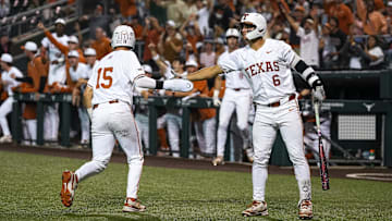 Texas Longhorns catcher Ryan Galvan (6) celebrates a score by utility player Peyton Powell (15) during the game against Oklahoma State at UFCU Disch–Falk Field on Friday, May 3, 2024, in Austin.