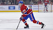 Nov 20, 2025; Montreal, Quebec, CAN; Montreal Canadiens defenseman Lane Hutson (48) plays the puck against the Washington Capitals during the first period at the Bell Centre. Mandatory Credit: Eric Bolte-Imagn Images