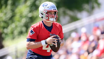 Jul 26, 2024; Foxborough, MA, USA; New England Patriots quarterback Bailey Zappe (4) throws a pass during training camp at Gillette Stadium.