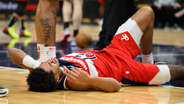 Jan 1, 2025; Washington, District of Columbia, USA; Washington Wizards guard Jordan Poole (13) reacts after falling during the second quarter against the Chicago Bulls at Capital One Arena. 