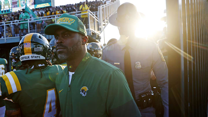 Norfolk State Spartans head coach Michael Vick walks onto the field before the first game of his coaching career against the Towson Tigers Norfolk State Spartans head coach Michael Vick walks onto the field before the first game of his coaching career against the Towson Tigers
