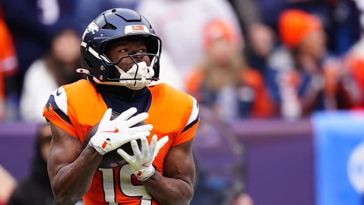 Jan 25, 2026; Denver, CO, USA; Denver Broncos wide receiver Marvin Mims Jr. (19) makes a catch against the New England Patriots during the first half in the 2026 AFC Championship Game at Empower Field at Mile High. Mandatory Credit: Ron Chenoy-Imagn Images