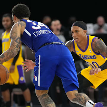 Dec 21, 2021; Las Vegas, NV, USA; South Bay Lakers forward Nate Pierre-Louis (00) defends against Delaware Blue Coats guard Jarron Cumberland (34) during the fourth quarter at Mandalay Bay Convention Center. Mandatory Credit: Stephen R. Sylvanie-Imagn Images