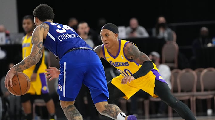 Dec 21, 2021; Las Vegas, NV, USA; South Bay Lakers forward Nate Pierre-Louis (00) defends against Delaware Blue Coats guard Jarron Cumberland (34) during the fourth quarter at Mandalay Bay Convention Center. Mandatory Credit: Stephen R. Sylvanie-Imagn Images