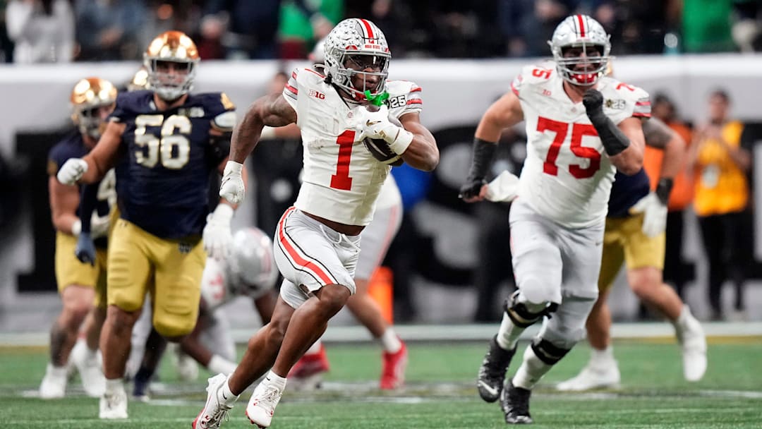 Ohio State Buckeyes running back Quinshon Judkins (1) gets away from the Notre Dame Fighting Irish defense for a long run in the third quarter during the College Football Playoff championship at Mercedes-Benz Stadium in Atlanta on January 20, 2025.