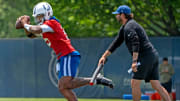 Colts Quarterback Anthony Richardson runs the gauntlet during Indianapolis Colts minicamp practice Tuesday, June 4, 2024 at the Indiana Farm Bureau Football Center.