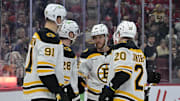 Apr 3, 2025; Montreal, Quebec, CAN; Boston Bruins forward Elias Lindholm (28) celebrates with teammates after scoring a goal against the Montreal Canadiens during the third period at the Bell Centre. Mandatory Credit: Eric Bolte-Imagn Images