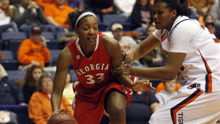 Jan 31, 2010; Auburn, AL, USA; Georgia Bulldogs forward Angel Robinson (33) is guarded by Auburn Tigers center KeKe Carrier (33) during the first half at Beard Eaves Memorial Coliseum in Auburn. Mandatory Credit: John Reed-Imagn Images Jan 31, 2010; Auburn, AL, USA; Georgia Bulldogs forward Angel Robinson (33) is guarded by Auburn Tigers center KeKe Carrier (33) during the first half at Beard Eaves Memorial Coliseum in Auburn. Mandatory Credit: John Reed-Imagn Images