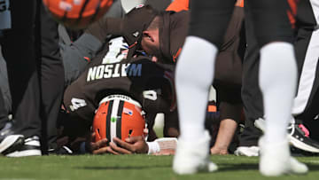 Oct 20, 2024; Cleveland, Ohio, USA; Cleveland Browns quarterback Deshaun Watson (4) lies on the ground after being injured during the first half against the Cincinnati Bengals at Huntington Bank Field. Mandatory Credit: Ken Blaze-Imagn Images
