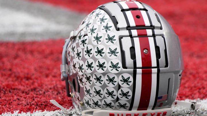 Oct. 1, 2022; Columbus, Ohio, USA; A stick-ladden Ohio State Buckeyes helmet sits on the turf during warmups before Saturday's game against the Rutgers Scarlet Knights in Columbus. Mandatory Credit: Barbara Perenic/Columbus Dispatch

Sports Ohio State Rutgers Ncaa Football