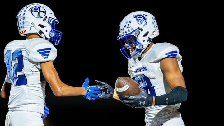 Bishop Chatard High School juniors Julio Graves (88), right, and Cam Harden (82) celebrate after scoring during the first half of an IHSAA varsity football game against Tri-West Hendricks High School, Friday, Oct. 10, 2025, at Tri-West Hendricks High School. Bishop Chatard High School juniors Julio Graves (88), right, and Cam Harden (82) celebrate after scoring during the first half of an IHSAA varsity football game against Tri-West Hendricks High School, Friday, Oct. 10, 2025, at Tri-West Hendricks High School.