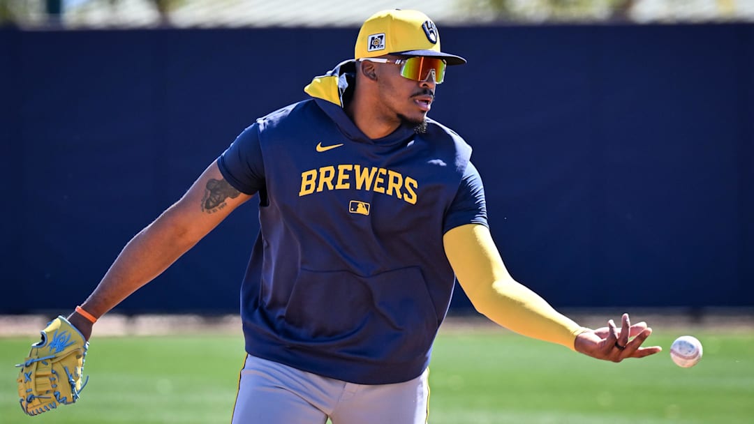 Infielder Ernesto Martinez Jr. flips the ball to first during spring training workouts Saturday, February 15, 2025, at the American Family Fields of Phoenix in Phoenix, Arizona.
