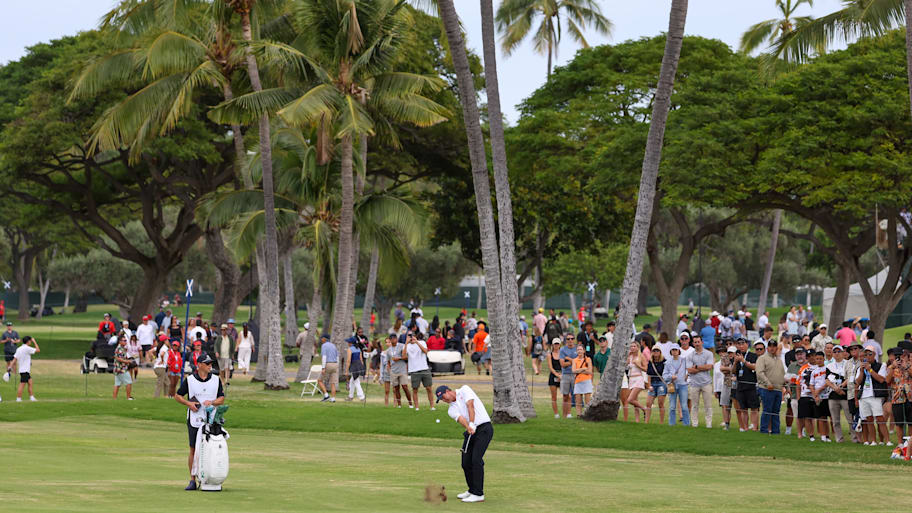 Adam Scott, of Australia, hits his ball off the 18th fairway during the final round of the Sony Open in Hawaii.