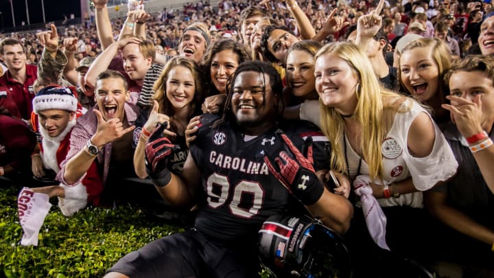 Former South Carolina football defensive tackle Taylor Stallworth celebrating with Gamecock fans after a win