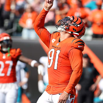 Sep 14, 2025; Cincinnati, Ohio, USA;  Cincinnati Bengals defensive end Trey Hendrickson (91) celebrates his sack during the fourth quarter against the Jacksonville Jaguars at Paycor Stadium. Mandatory Credit: Joseph Maiorana-Imagn Images