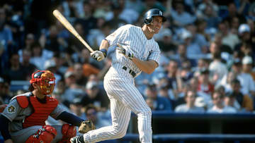 Paul O'Neill of the New York Yankees swings his bat in home pinstripes.