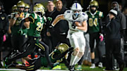 Oconomowoc tight end Emmett Bork (8) works for yardage after a catch against Racine Case in a Division 1 first-round playoff game Friday, October 25, 2024, at Hammes Field in Racine, Wisconsin.