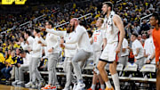 Mar 2, 2025; Ann Arbor, Michigan, USA; The Illinois Fighting Illini bench reacts to a guard made three point shot against the Michigan Wolverines in the second half at Crisler Center. Mandatory Credit: Lon Horwedel-Imagn Images
