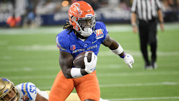 Dec 16, 2023; Inglewood, CA, USA; Boise State Broncos running back Ashton Jeanty (2) slips a tackle by UCLA Bruins linebacker Darius Muasau (53) during the first quarter of the Starco Brands LA Bowl at SoFi Stadium.