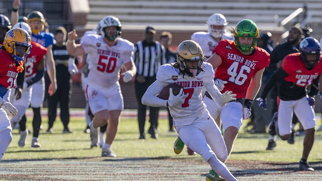 Jan 28, 2026; Mobile, AL, USA; National Team wide receiver Tyren Montgomery (7) of John Carroll runs after a catch during National Senior Bowl practice at Hancock Whitney Stadium. Mandatory Credit: Vasha Hunt-Imagn Images
