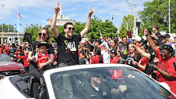 Jun 17, 2019; Toronto, Ontario, Canada; Toronto raptors general Manager Bobby Webster and his family celebrate with fans during the Toronto Raptors Championship Parade on Lakeshore Boulevard. Mandatory Credit: Gerry Angus-Imagn Images