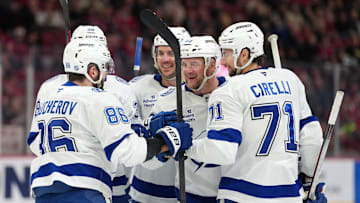Dec 9, 2025; Montreal, Quebec, CAN; Tampa Bay Lightning defenseman Darren Raddysh (43) celebrates with teammates including forward Nikita Kucherov (86) and defenseman Max crozier (24) and forward Anthony Cirelli (71) after scoring a goal against the Montreal Canadiens during the third period at the Bell Centre. Mandatory Credit: Eric Bolte-Imagn Images