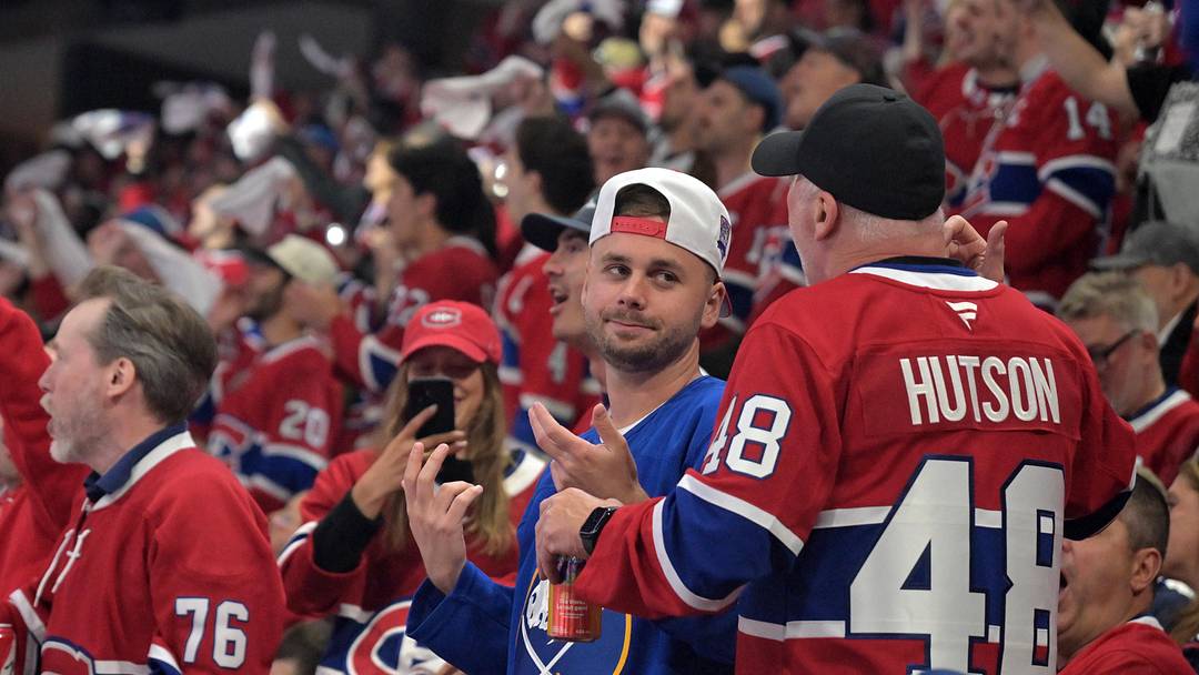 May 10, 2026; Montreal, Quebec, CAN; Buffalo Sabres fan and Montreal Canadiens fan during the second period in game three of the second round of the 2026 Stanley Cup Playoffs at the Bell Centre. Mandatory Credit: Eric Bolte-Imagn Images