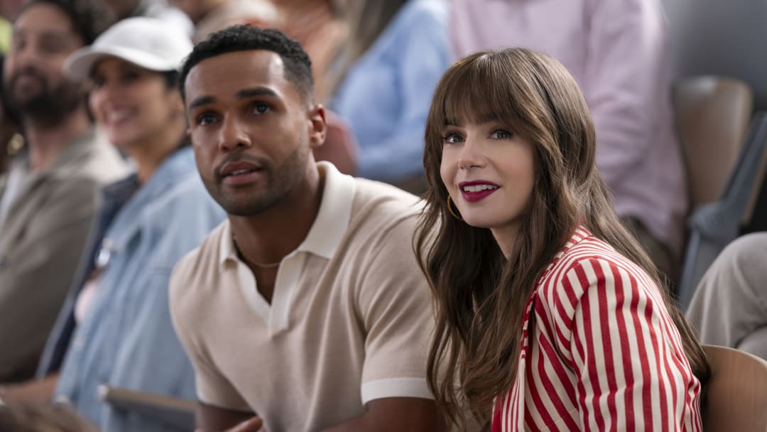 Emily in Paris. (L to R) Lucien Laviscount as Alfie, Lily Collins as Emily in Emily in Paris. Cr. Stephanie Branchu/Netflix © 2024