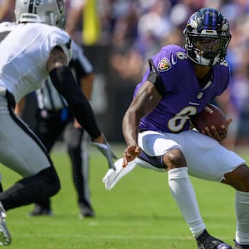 Sep 15, 2024; Baltimore, Maryland, USA; Baltimore Ravens quarterback Lamar Jackson (8) scrambles during the first half against the Las Vegas Raiders at M&T Bank Stadium. Mandatory Credit: Reggie Hildred-Imagn Images