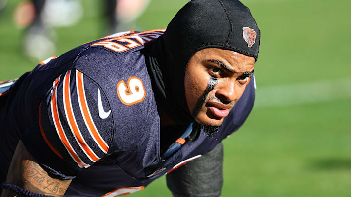 Nov 23, 2025; Chicago, Illinois, USA; Chicago Bears safety Jaquan Brisker (9) stretches before the game against the Pittsburgh Steelers at Soldier Field.