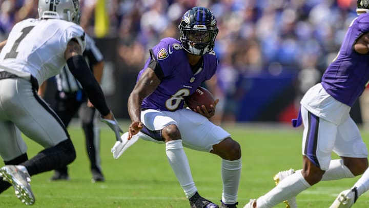 Sep 15, 2024; Baltimore, Maryland, USA; Baltimore Ravens quarterback Lamar Jackson (8) scrambles during the first half against the Las Vegas Raiders at M&T Bank Stadium. Mandatory Credit: Reggie Hildred-Imagn Images