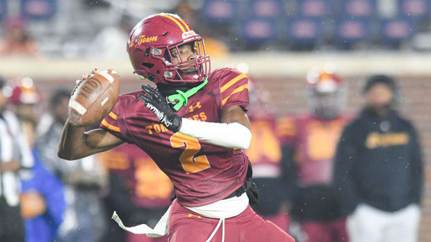 Laurel's Kobe Pierce loads up for a pass against West Point in the MHSAA Class 5A State Championship on Nov. 30, 2023