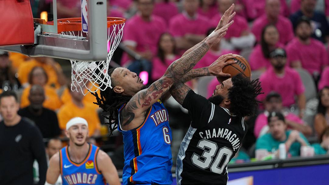 May 22, 2026; San Antonio, Texas, USA; San Antonio Spurs forward Julian Champagnie (30) shoots the ball over Oklahoma City Thunder forward Jaylin Williams (6) in the second half during game three of the Western Conference Finals for the 2026 NBA Playoffs at Frost Bank Center.