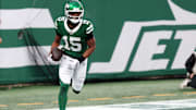 Nov 30, 2025; East Rutherford, New Jersey, USA;New York Jets wide receiver Adonai Mitchell (15) reacts after a touchdown catch against the Atlanta Falcons during the second half at MetLife Stadium. Mandatory Credit: Vincent Carchietta-Imagn Images