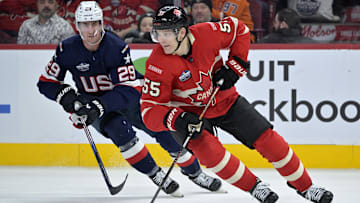 Feb 15, 2025; Montreal, Quebec, CAN; [Imagn Images direct customers only] Team Canada defenseman Colton Parayko (55) plays the puck and Team United States forward Brock Nelson (29) defends in the third period during a 4 Nations Face-Off ice hockey game at the Bell Centre. Mandatory Credit: Eric Bolte-Imagn Images