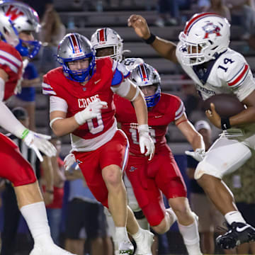 Atascosita's Cardae Mack (14) carries the ball on Westlake late in a non-district Texas 6A football game between two of the state's top six teams on Friday, Sept 13.