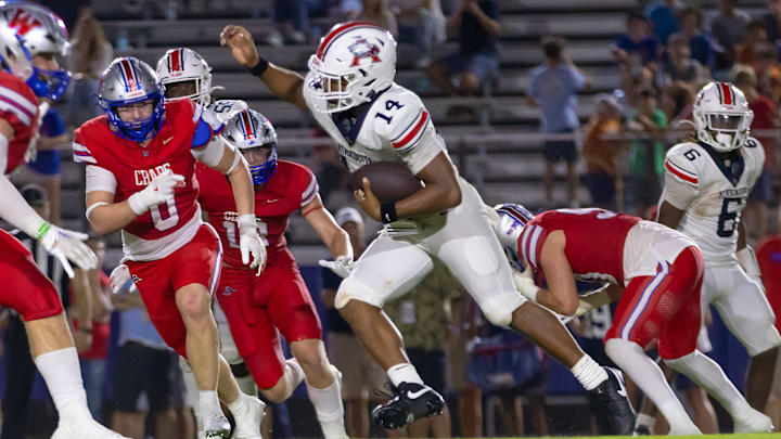 Atascosita's Cardae Mack (14) carries the ball on Westlake late in a non-district Texas 6A football game between two of the state's top six teams on Friday, Sept 13.