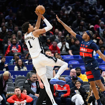 Feb 10, 2025; Washington, District of Columbia, USA; San Antonio Spurs center Victor Wembanyama (1) takes a shot over Washington Wizards guard Bilal Coulibaly (0) during the first quarter at Capital One Arena. Mandatory Credit: Reggie Hildred-Imagn Images