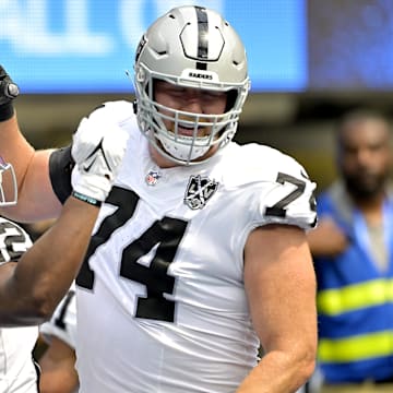 Sep 8, 2024; Inglewood, California, USA; Las Vegas Raiders running back Alexander Mattison (22) is congratulated by offensive tackle Kolton Miller (74) after scoring a touchdown in the first half against the Los Angeles Chargers at SoFi Stadium. Mandatory Credit: Jayne Kamin-Oncea-Imagn Images