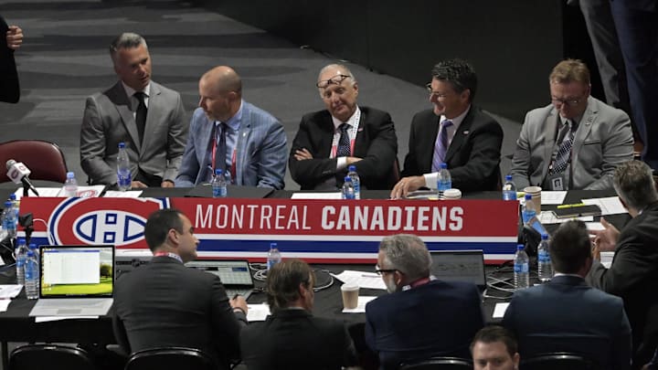Jul 8, 2022; Montreal, Quebec, CANADA; General view of the Montreal Canadiens table during the second round of the 2022 NHL Draft at the Bell Centre. Montreal Canadiens head coach Martin St-Louis and General Manager Kent Hughes on the left. Mandatory Credit: Eric Bolte-Imagn Images