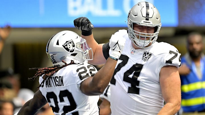 Sep 8, 2024; Inglewood, California, USA; Las Vegas Raiders running back Alexander Mattison (22) is congratulated by offensive tackle Kolton Miller (74) after scoring a touchdown in the first half against the Los Angeles Chargers at SoFi Stadium. Mandatory Credit: Jayne Kamin-Oncea-Imagn Images