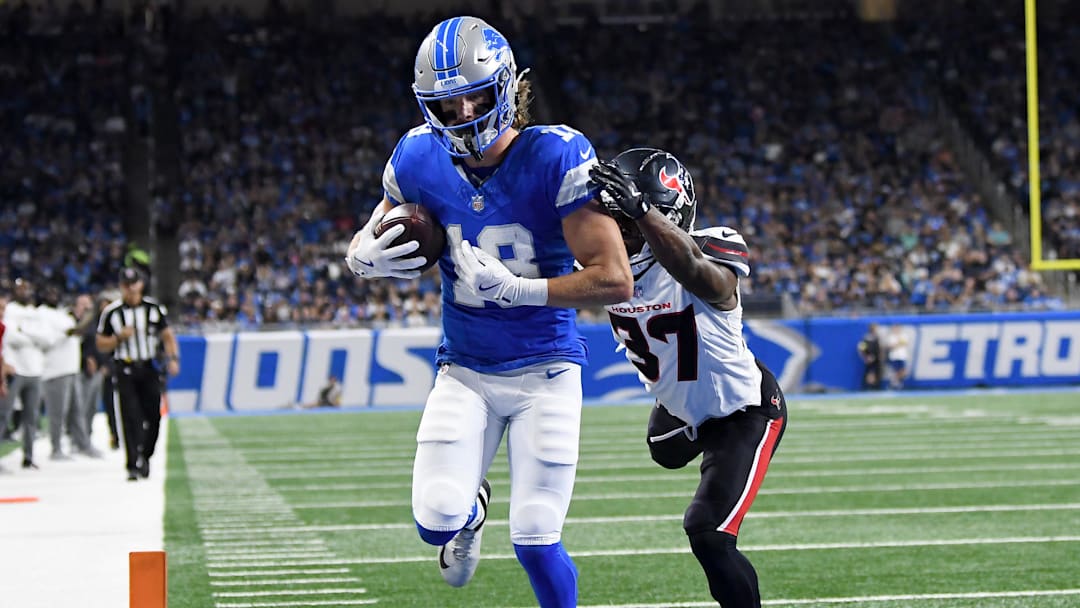 Aug 23, 2025; Detroit, Michigan, USA; Detroit Lions wide receiver Isaac TeSlaa (18) scores a touchdown against the Houston Texans in the first quarter at Ford Field. Mandatory Credit: Eamon Horwedel-Imagn Images