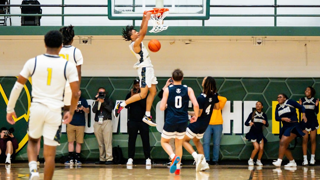 Garfield Heights senior Marcus Johnson makes a slam dunk against Hoban in the Division III regional semifinal round on March 10. Johnson recently secured his second consecutive Ohio Mr. Basketball award. Garfield Heights senior Marcus Johnson makes a slam dunk against Hoban in the Division III regional semifinal round on March 10. Johnson recently secured his second consecutive Ohio Mr. Basketball award.