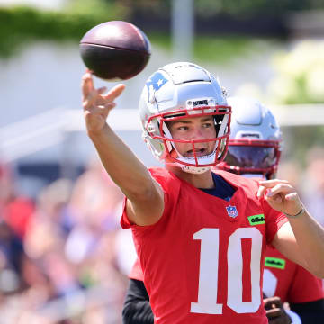 Jul 26, 2024; Foxborough, MA, USA; New England Patriots quarterback Drake Maye (10) throws a pass during training camp at Gillette Stadium. Mandatory Credit: Eric Canha-USA TODAY Sports