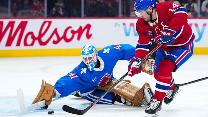 Jan 29, 2026; Montreal, Quebec, CAN; Montreal Canadiens forward Nick Suzuki (14) scores a goal against Colorado Avalanche goalie Scott Wedgewood (41) during the first period at the Bell Centre. Mandatory Credit: Eric Bolte-Imagn Images