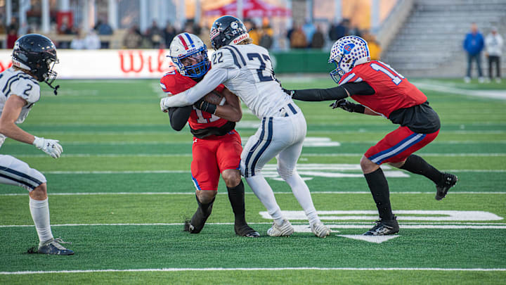 Columbine senior Troy Johnson tackles a Cherry Creek player during the Colorado 5A football state championship against Cherry Creek on Saturday, December 2, 2023 at Canvas Stadium in Fort Collins, Colo. Columbine won 28-14. Columbine senior Troy Johnson tackles a Cherry Creek player during the Colorado 5A football state championship against Cherry Creek on Saturday, December 2, 2023 at Canvas Stadium in Fort Collins, Colo. Columbine won 28-14.